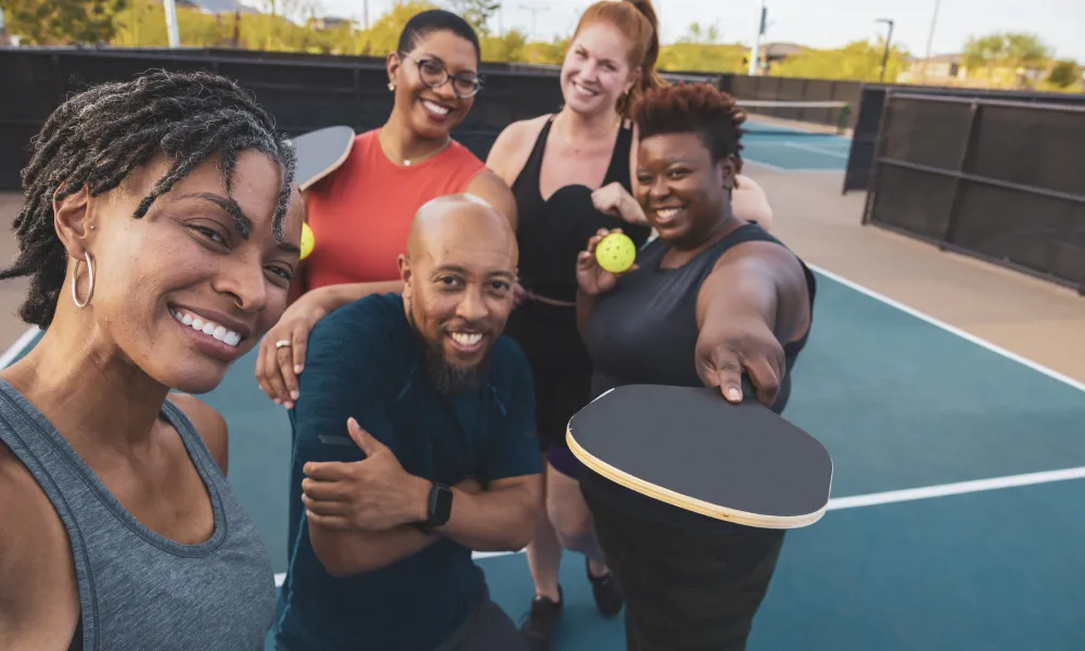 Group of friends playing pickleball.