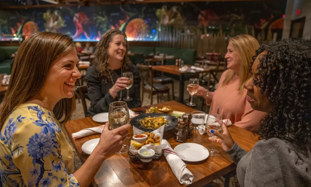 Four girlfriends dining inside at Kites Restaurant