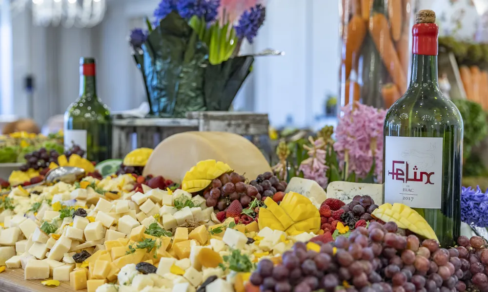 Food display of fruit and cheese.