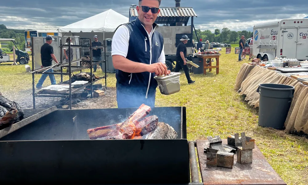 Open fire cooking meat at NJ Beer &amp; Food Festival