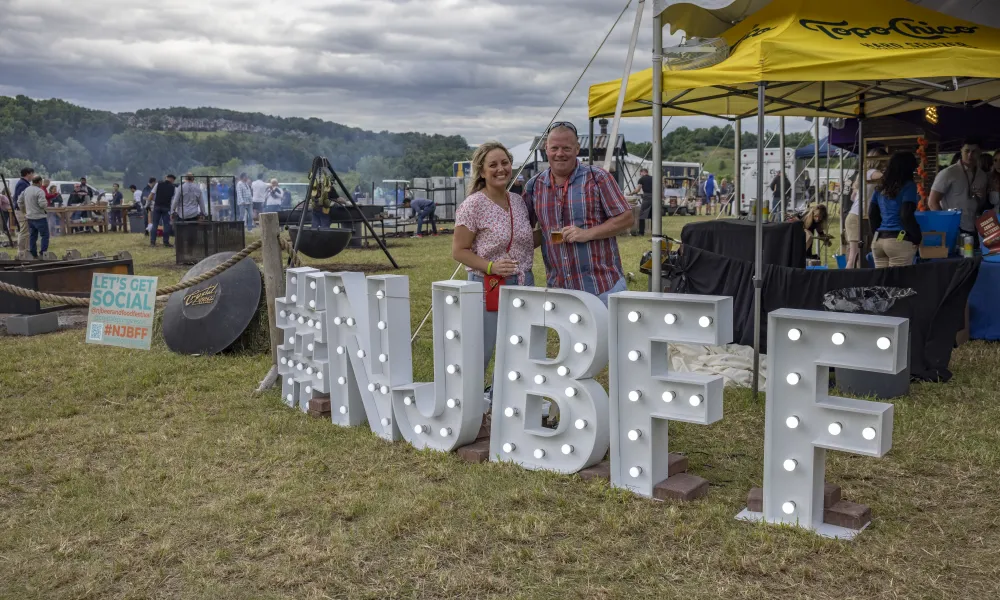 Couple at #NJBFF sign