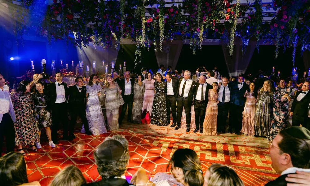 People standing around dance floor at Big Sky Pavillion.