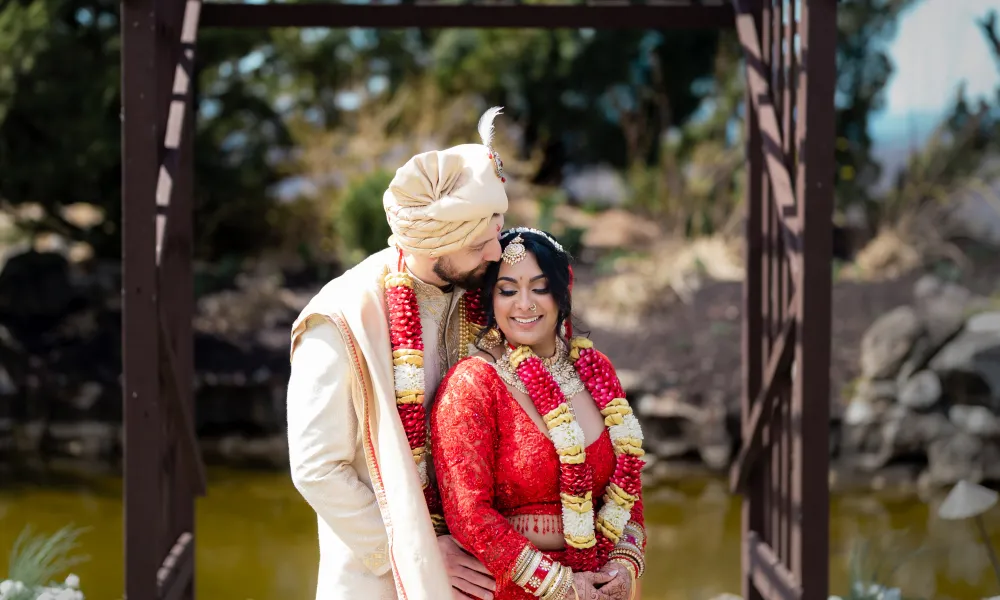 Indian bride and groom at wedding alter