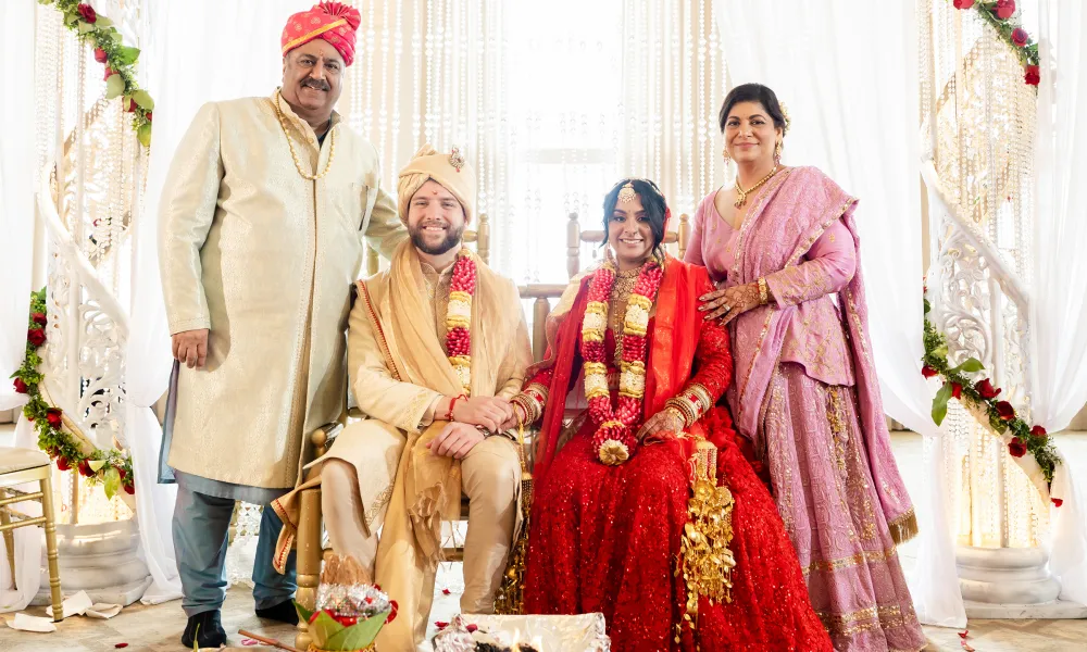 Indian bride and groom with parents