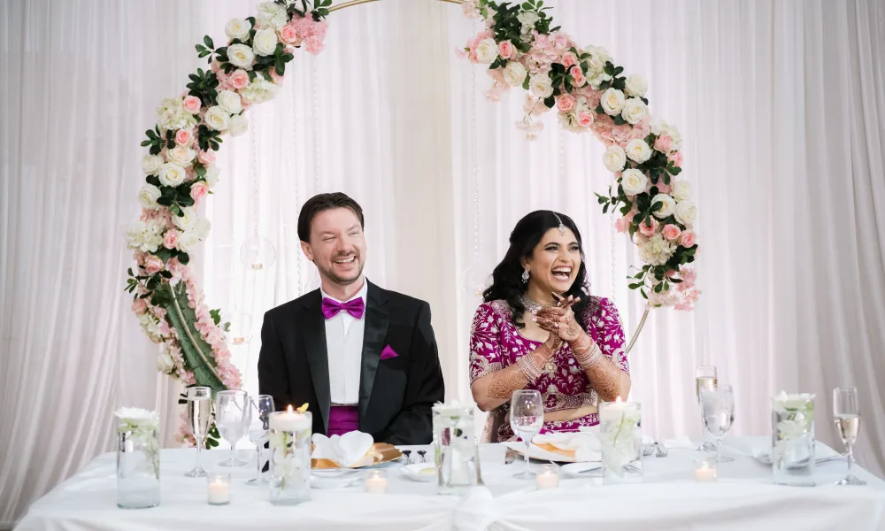 Indian bride and Groom at wedding table