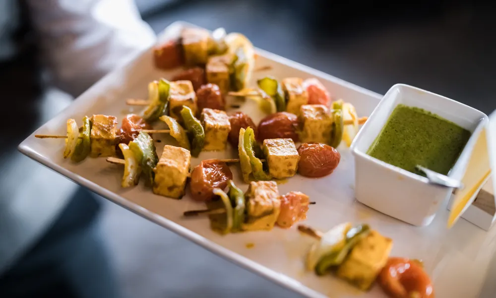 Kebab served on plates during cocktail hour.