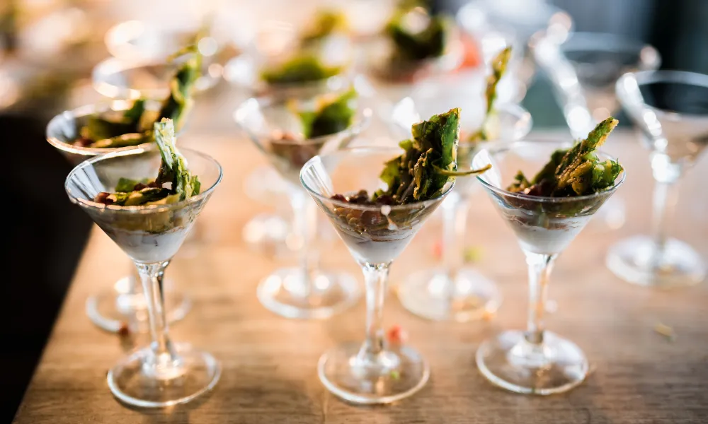 Snacks in martini glasses.