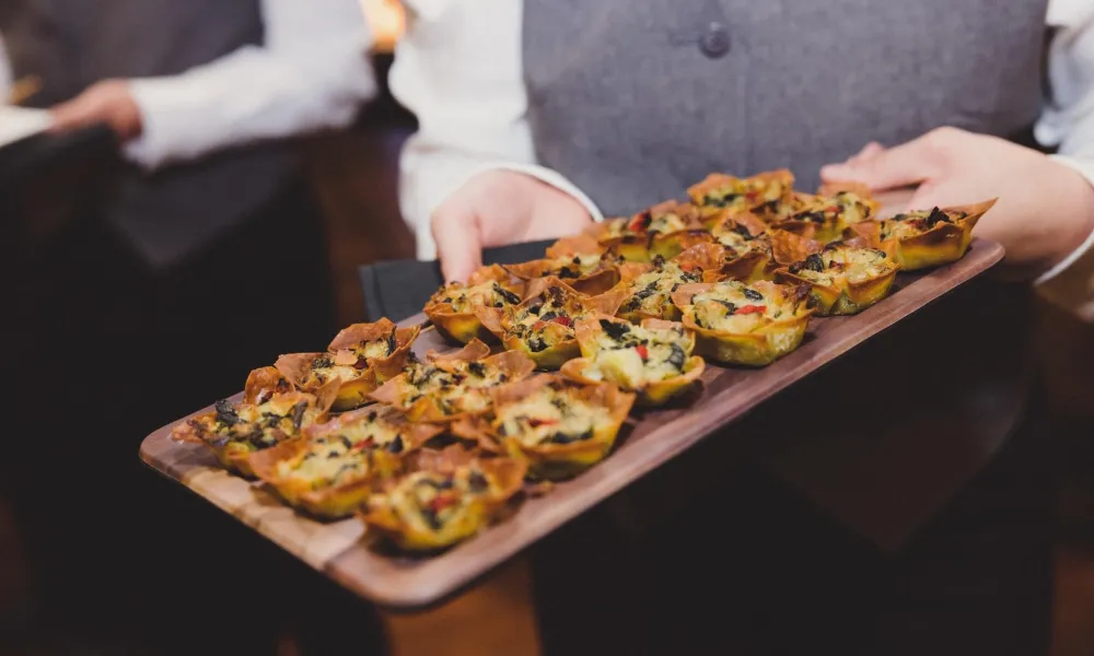 Waiter holding Hors d'oeuvres platter