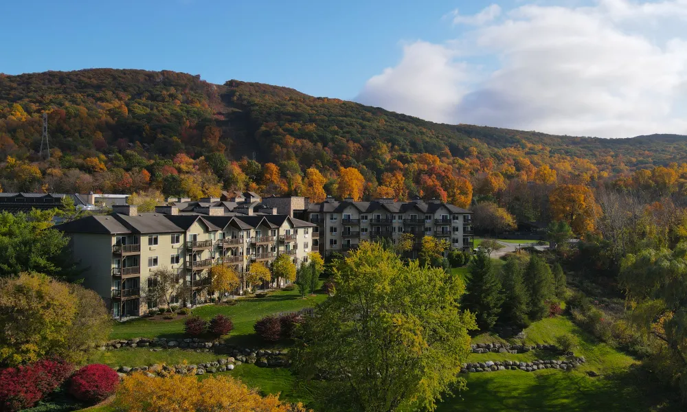 Minerals Hotel sits in front of fall mountain range.