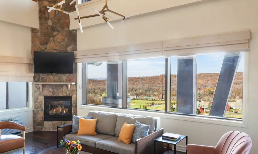 Living room area with a view of the mountains at Grand Cascades Lodge