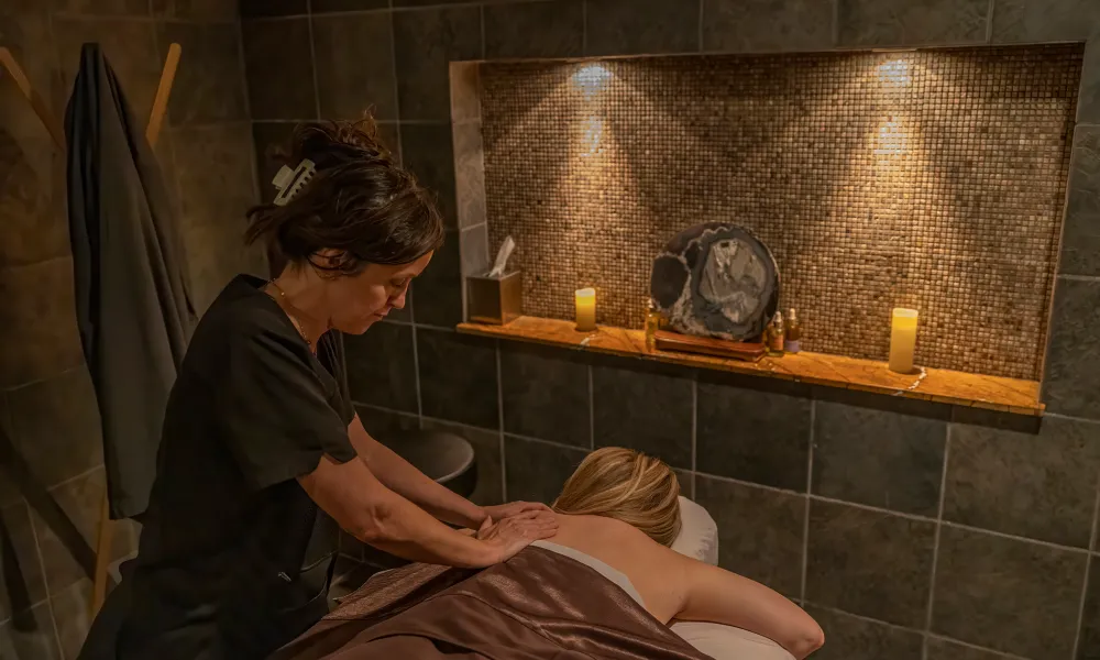 Woman receiving a massage at Elements Spa.