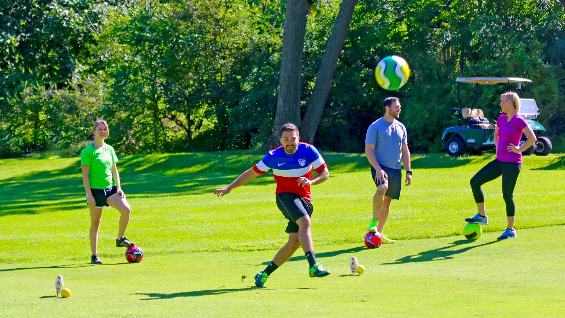 Friends playing a round of foot golf at a resort close to NYC