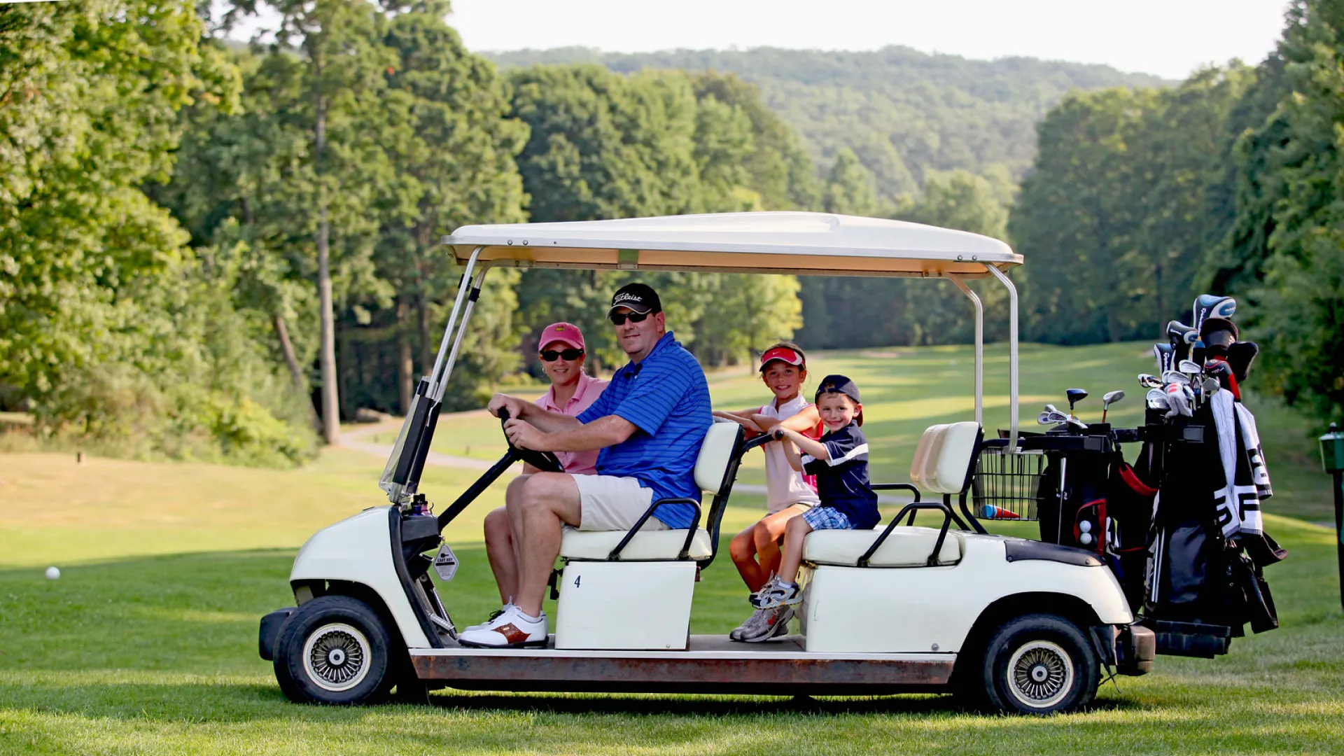 Parents with their kids on a family friendly golf course at Crystal Springs Resort in New Jersey.