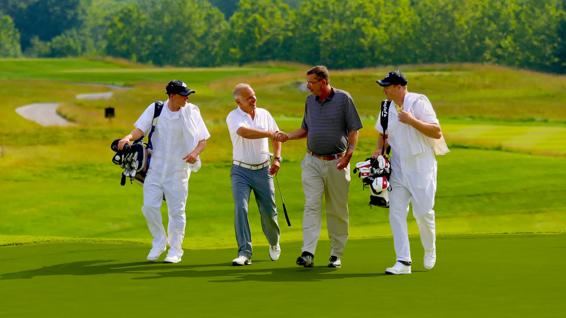 Golfers and Caddies at a golf resort close to New York City