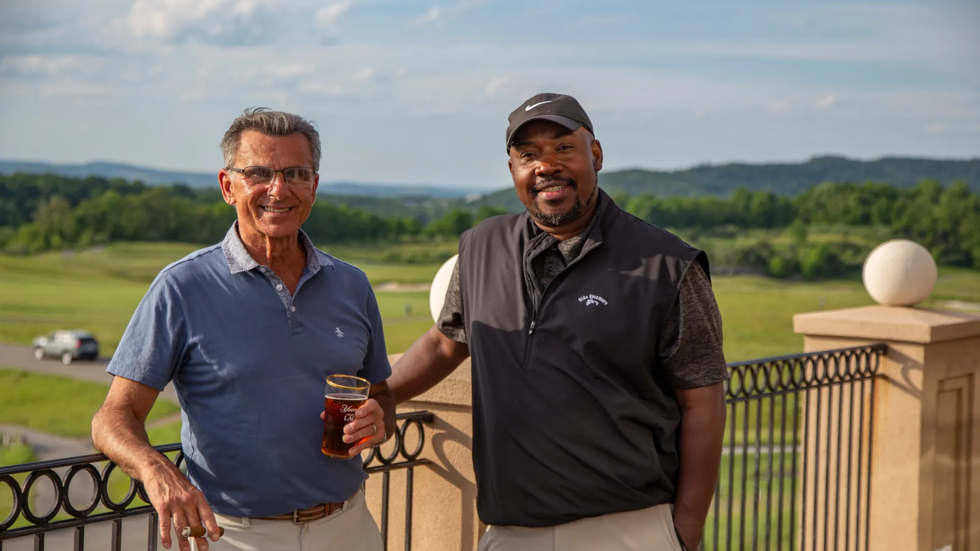 Two guys on the outdoor patio of a golf club at Crystal Springs Resort