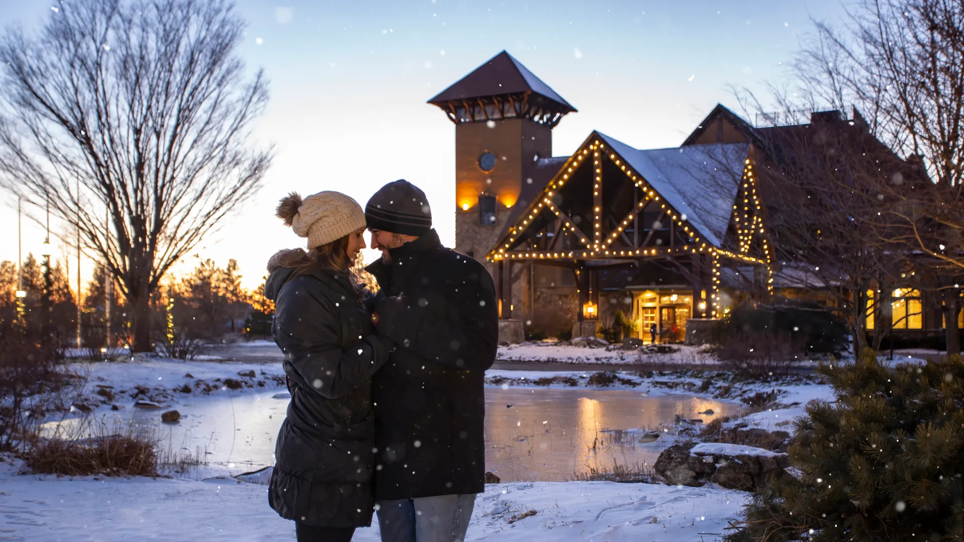 A winter couple outside the Clubhouse at a resort near NYC