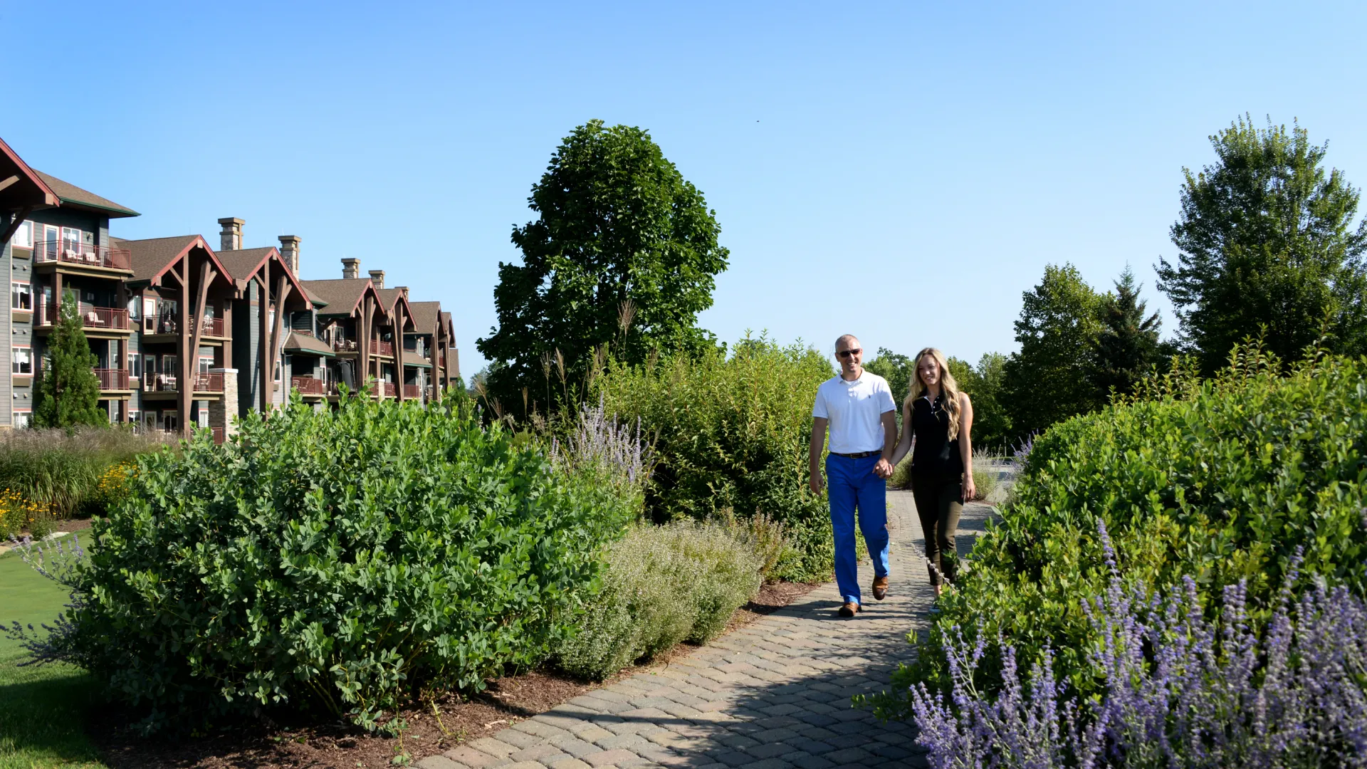 Couple walking the grounds of Grand Cascades Lodge