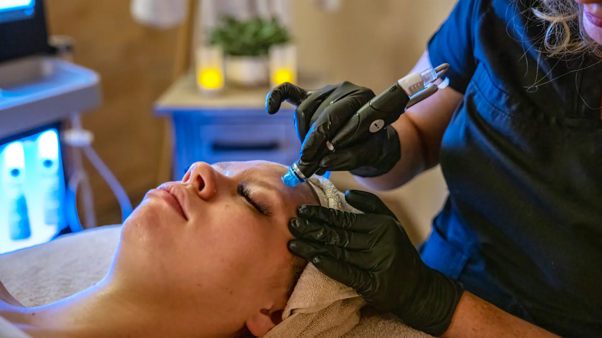 Woman receiving hydrafacial.