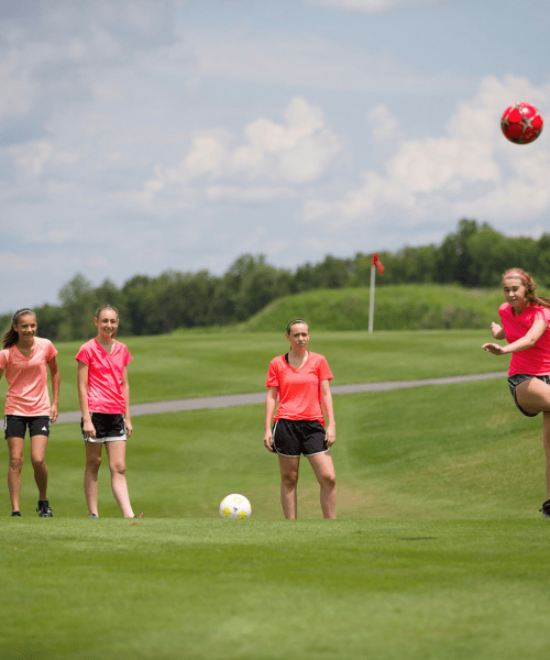 Four girls playing foot golf at Crystal Springs Resort