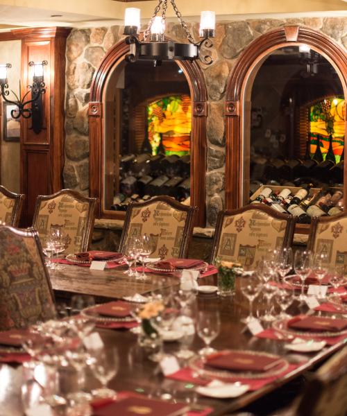 Wine Cellar Bordeaux Room set up long wooden dinner tables.