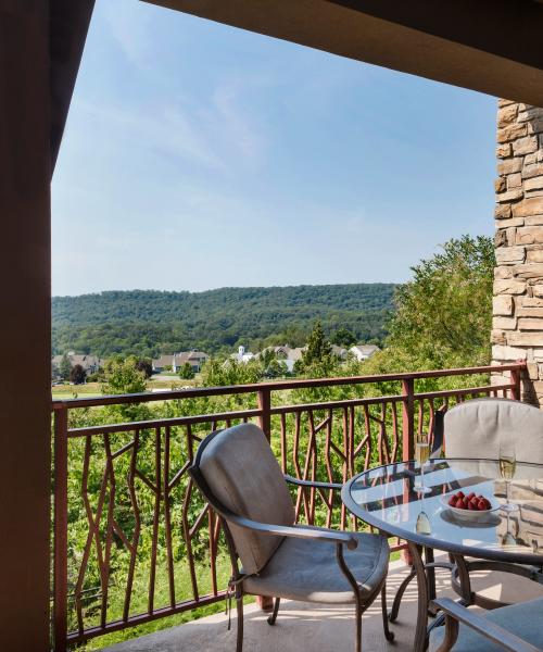 Balcony overlooking golf course and mountains