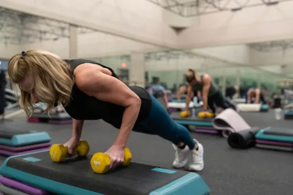 MSC Instructor Betty in plank on step up.