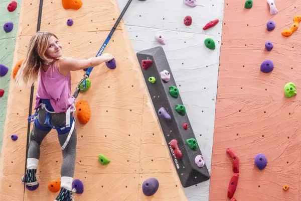 Young girl rock climbing. 