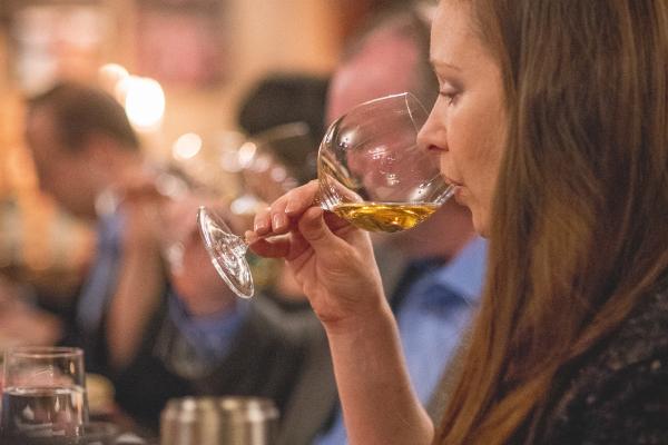 Woman drinking white wine.