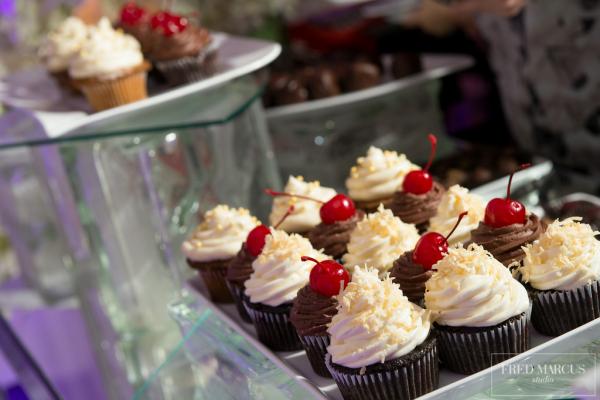 Chocolate and vanilla cupcakes with cherries