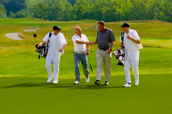 Golfers and Caddies at a golf resort close to New York City