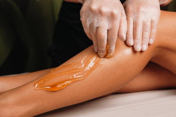 Leg hair removal with wax.