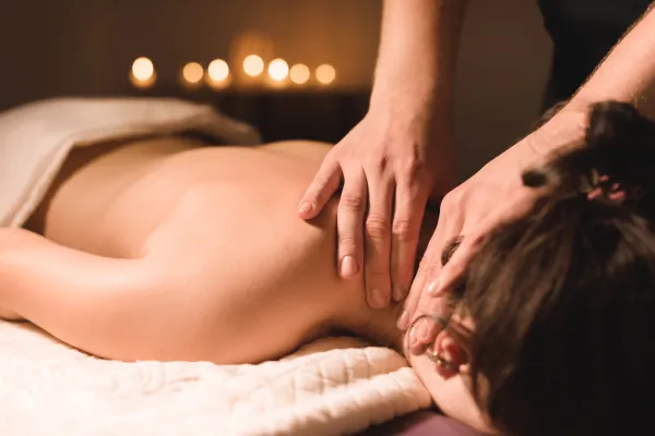 Woman receiving a massage on her neck.