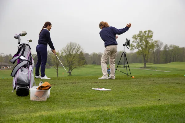 Girl taking golf lessons at Crystal Springs Resort