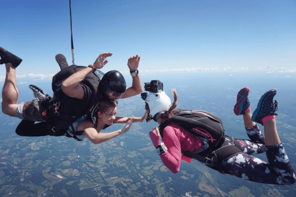 Three peopl skydiving.