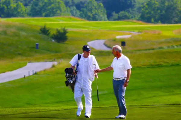 Golfer and Caddy on the course of Ballyowen at Crystal Springs Resort