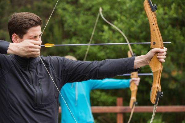 Male practicing archery. 