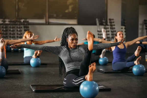 Group of women taking workout class.