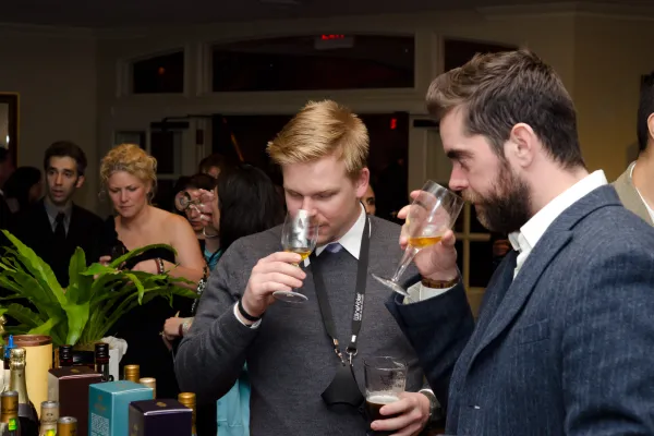 Men nosing wine at NJ Wine and Food Festival