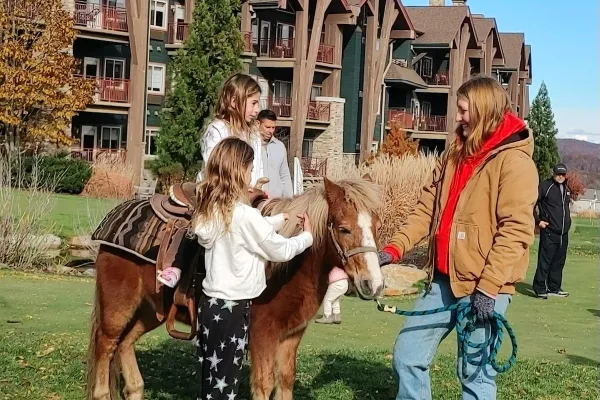 Child riding pony.