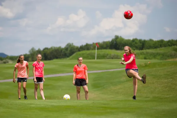 Four girls playing foot golf at a resort close to New York City