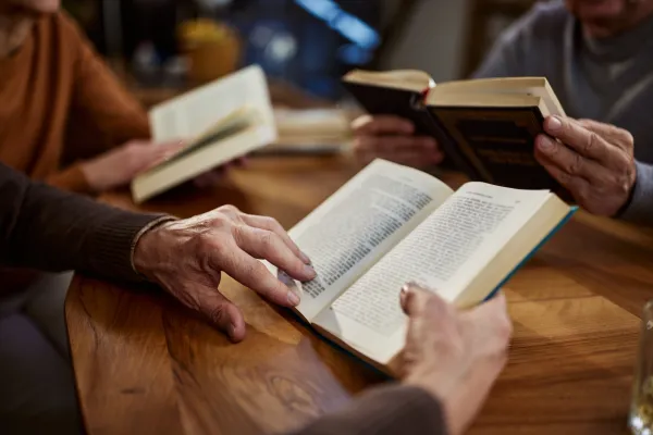 Person holding a book.