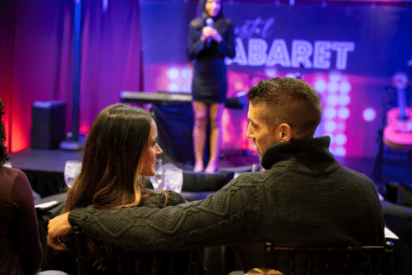 Couple sitting in front of Crystal Cabaret stage.