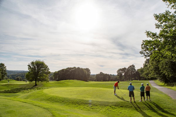 Four golfers on Black Bear golf course.