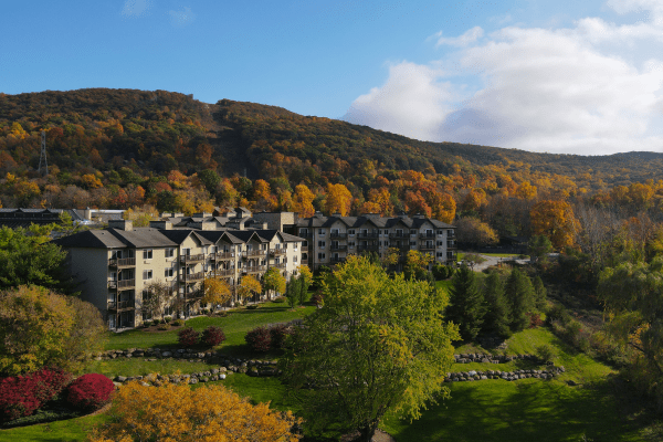 Minerals Hotel sits in front of fall mountain range.