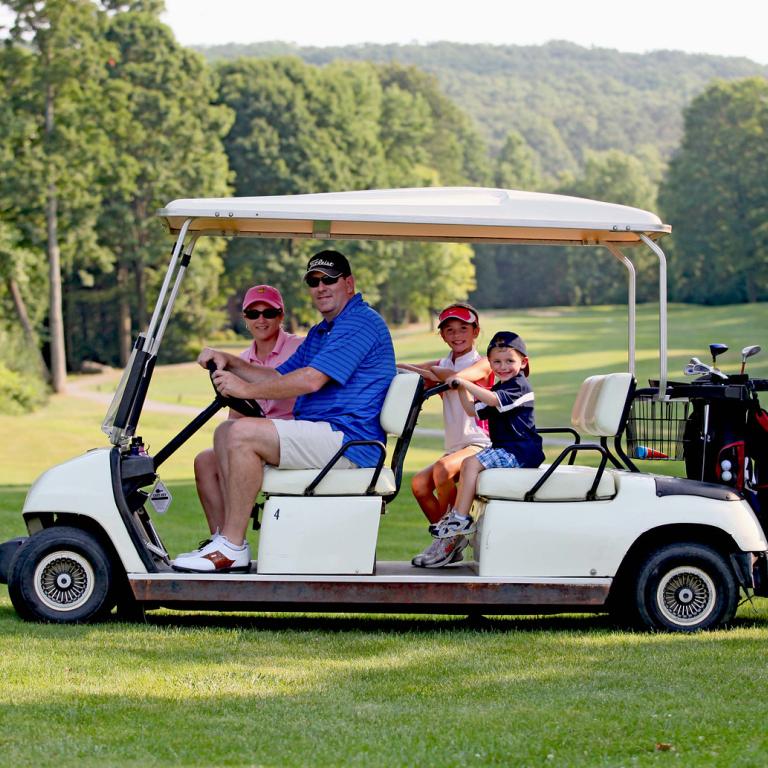 Parents with their kids on a family friendly golf course at Crystal Springs Resort in New Jersey.