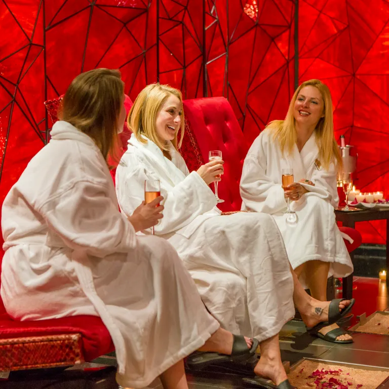 Group of women drinking champagne in Reflections Spa. 