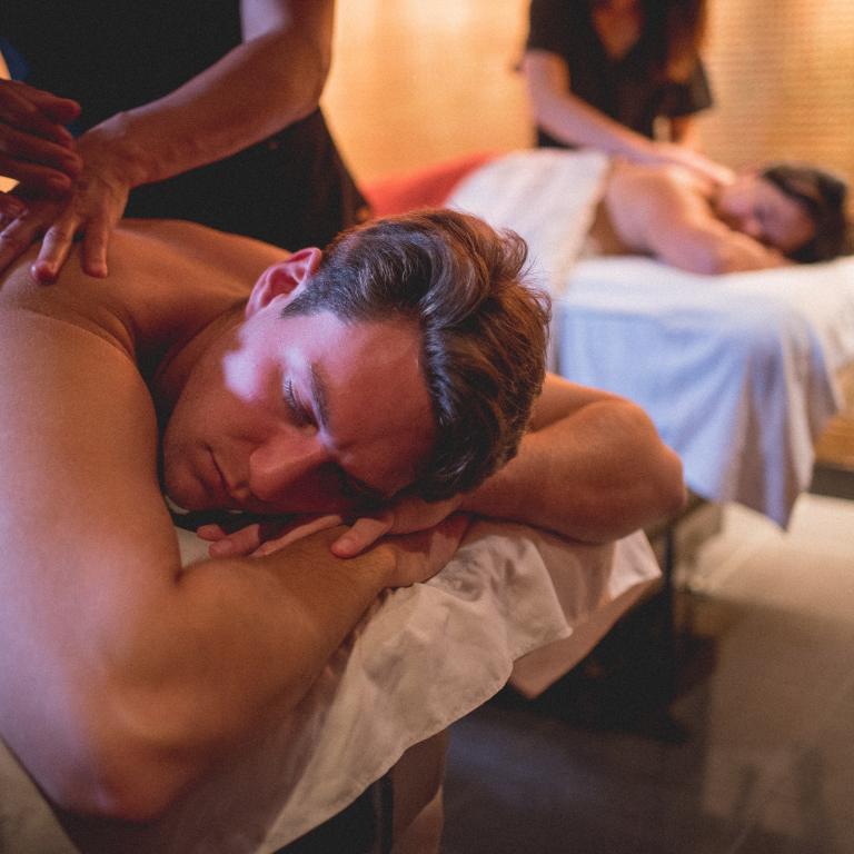 Two people getting massaged.