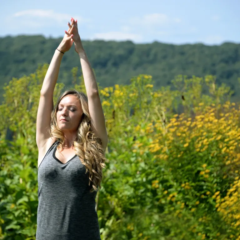 Woman doing Yoga Pose Outdoors