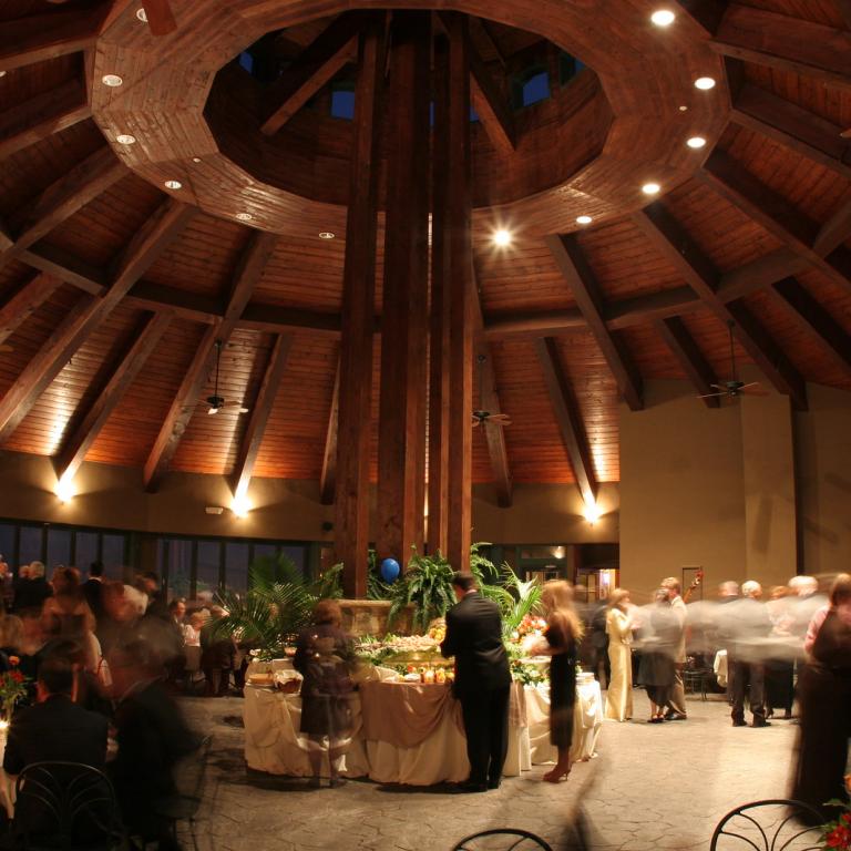 Guests dressed formal for an evening event in the Rotunda at Crystal Springs Resort