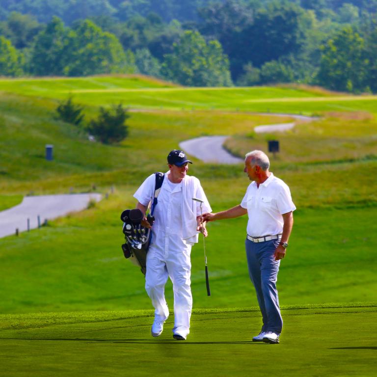 Golfer and Caddy on the course of Ballyowen at Crystal Springs Resort